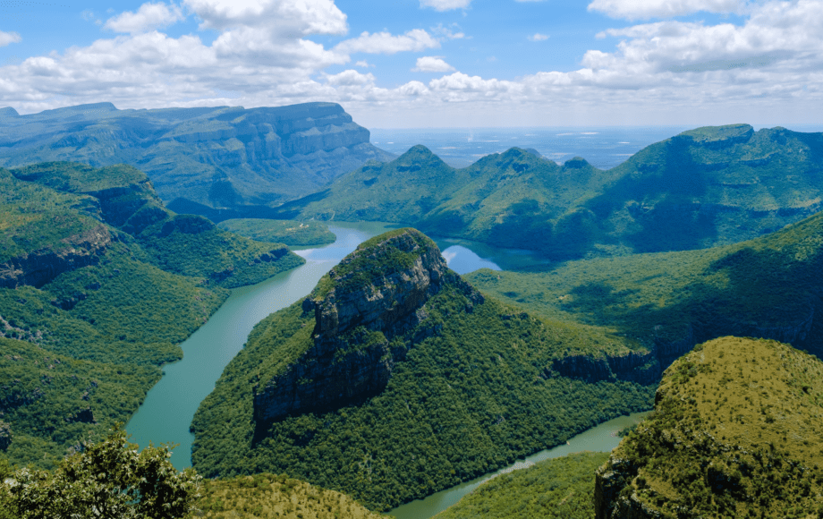Blyde River Canyon surrounded by lush mountains along South Africa’s Panorama Route.
