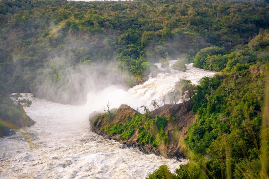 Murchison Falls surrounded by lush green landscapes in Uganda.