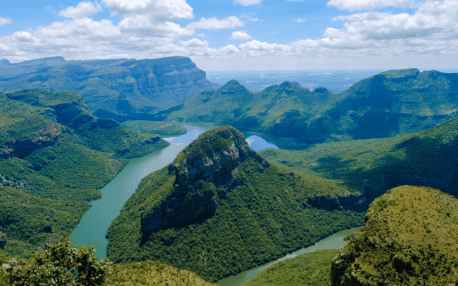 Blyde River Canyon surrounded by lush mountains along South Africa’s Panorama Route.