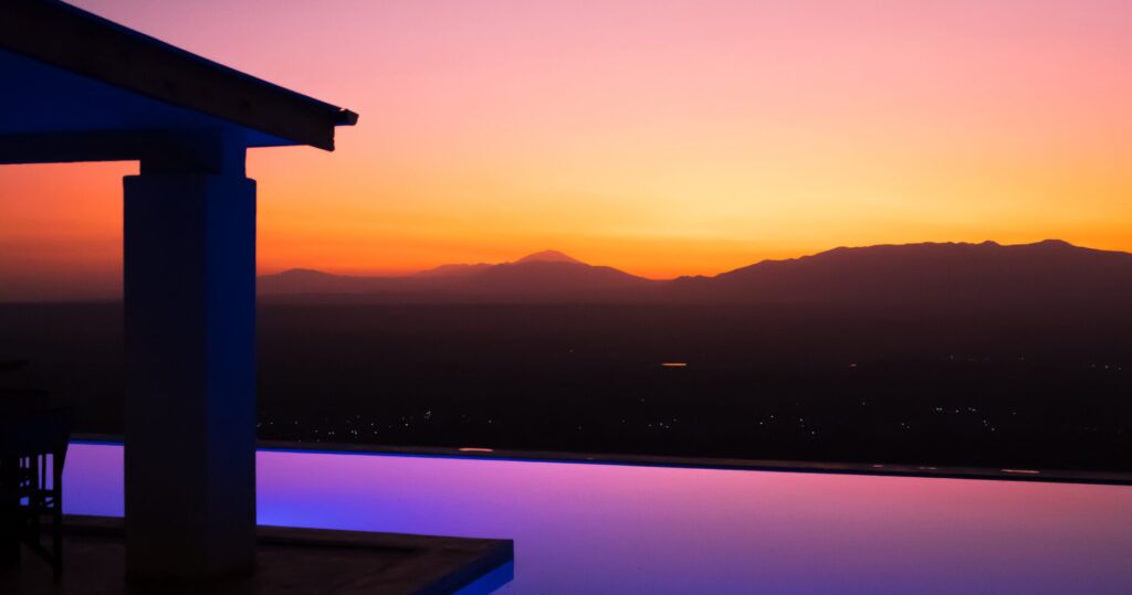 Infinity pool overlooking the landscape at sunset at Manyara Best View Lodge in Tanzania.