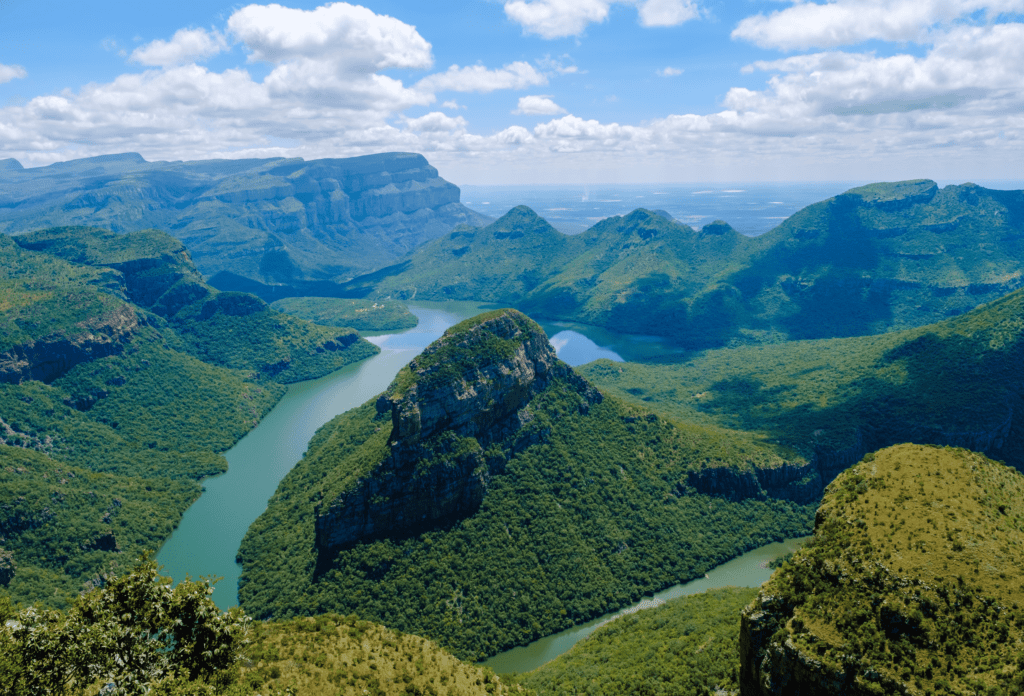 Blyde River Canyon surrounded by lush mountains along South Africa’s Panorama Route.