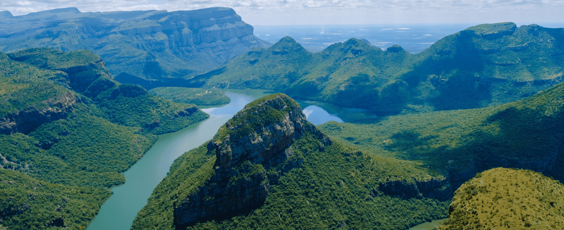 Blyde River Canyon surrounded by lush mountains along South Africa’s Panorama Route.